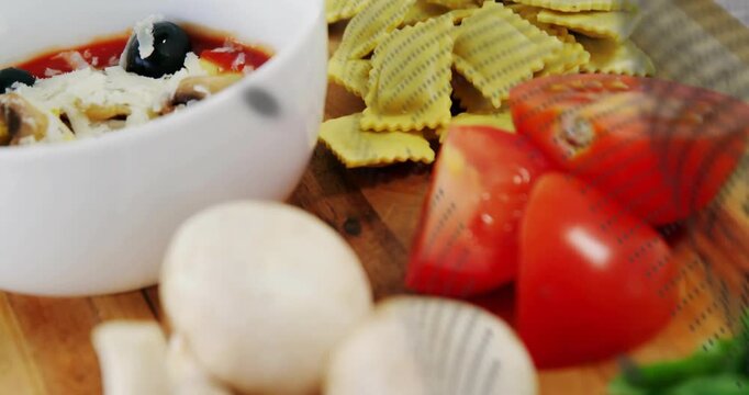 Food on board reacting to dotted sweep, camera panning, focusing mushrooms and tomatoes for food ad