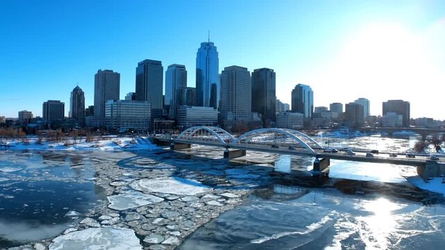 Ice floating on city river water.