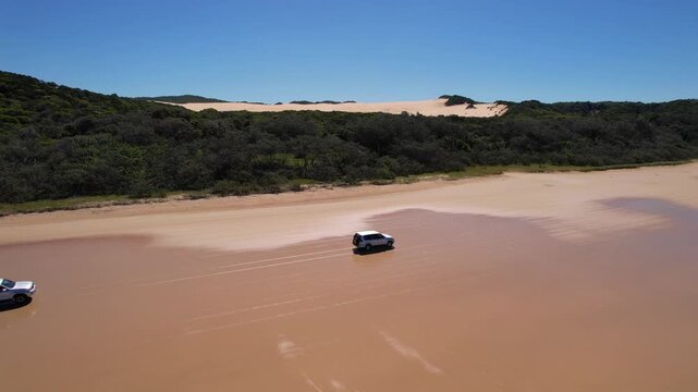 4WD Driving Along 75 Mile Beach, K'gari Fraser Island &ndash; Aerial Drone Tracking Shot, Queensland Australia