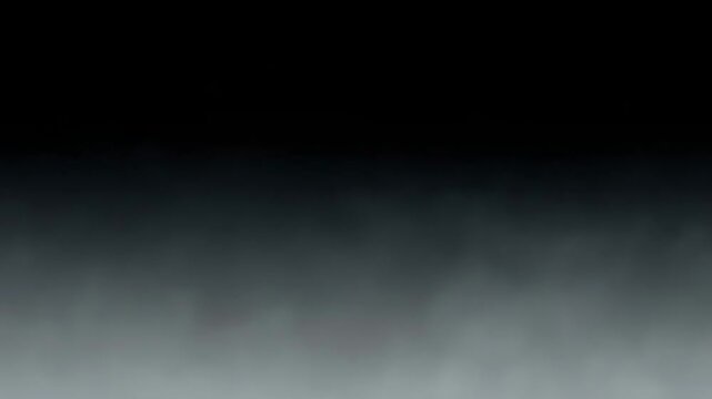 Abstract studio shot of dark, mysterious smoke rising and diffusing across a grey gradient background, creating an ethereal texture.