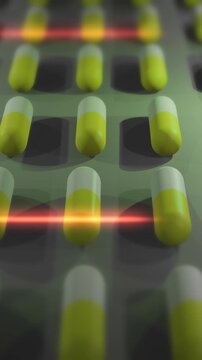  Yellow and White Drug Pills or Capsules being Produced in Lab - Vertical