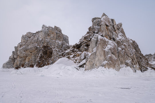 The Shaman rock at Burkhan cape covering by snow during winter season in Siberia, Russia. 