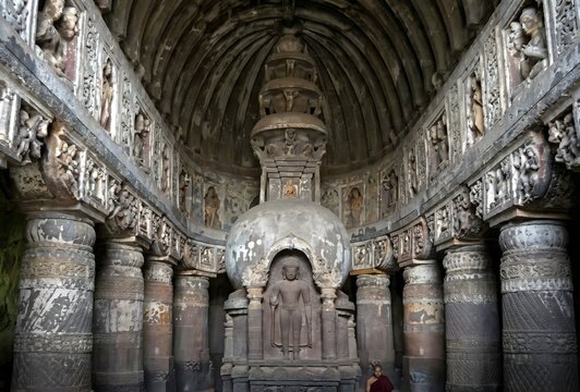 A magical, detailed interior shot of the main prayer hall (Chaitya) in Ajanta Caves, Cave 19, in Maharashtra, India. The image captures the ancient, rock-cut architecture, the towering stupa.