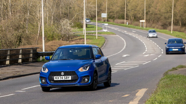 Milton Keynes,Bucks,UK - Mar 15th 2026: 2025 blue Suzuki Swift Sport hybrid electric cardriving on a British road
