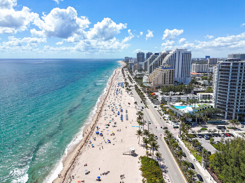 Long sandy beach and turquoise waters along Fort Lauderdale Beach in Broward County, Florida