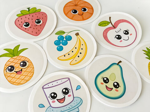 This image is a cute, big-eyed cartoon-style circular sticker/card with a white background. It features various fruits and foods drawn with smiling faces:
The bright colors and sharp lines make it per