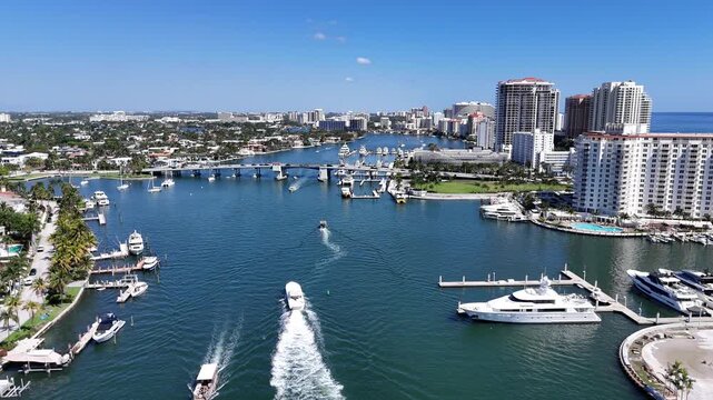 Boats cruising north in the intracoastal waterway near Las Olas Blvd Bridge in Fort Lauderdale in Broward County, Florida.