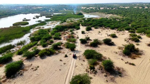 Drone shot of people doing offroad tour in the Achro Thar Desert