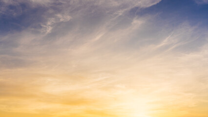 Obraz premium Golden Sky, Sunset sky cloud in summer Evening with Orange, Yellow, Blue sunlight, Horizon nature Golden hour Warm morning sunrise sky Background