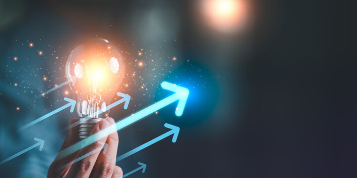 Innovation manager generating creative ideas with glowing light bulb ,rising arrows, symbolizing strategic growth, digital transformation, problem solving, entrepreneurial vision for competitive