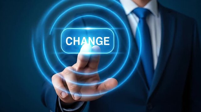 Business in blue suit pressing futuristic virtual change button concept for innovation
