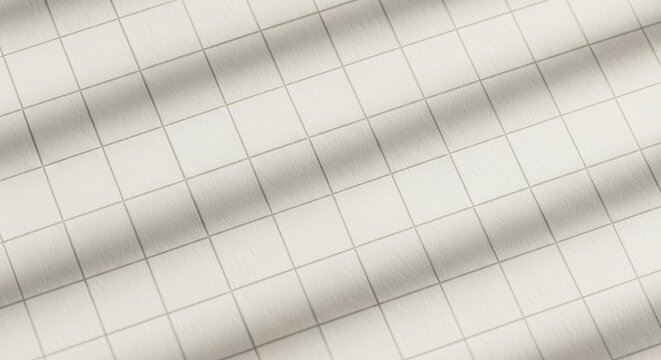 Close-up view of a light-colored surface with a subtle grid pattern, showing gentle waves and shadows.