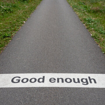 Road marked good enough indicating lowered standards acceptance and compromise within governance policy decisions and political accountability