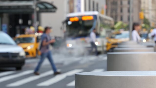 New York City Manhattan Downtown Financial District, United States. Defocused people pedestrians on Church street. Hot steam and zebra crosswalk on crossroad with Fulton street, USA. Yellow taxi car.