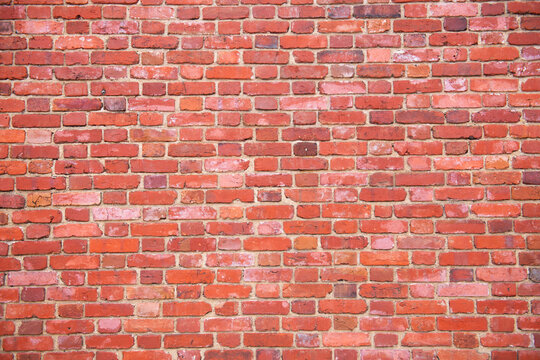 Bricks on wall texture. Bricks in masonry pattern. Bricks on redbrick surface. Bricks in rustic background.