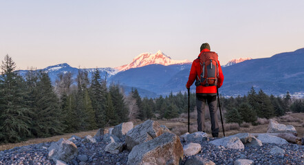 Hiker With Red Backpack Overlooking Snowy Mountain at Sunrise in BC, Canada — Outdoor Adventure © edb3_16