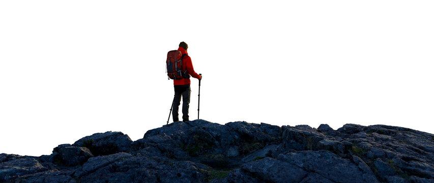 Hiker With Backpack And Trekking Poles Standing On Rocky Ridge Overlooking The Horizon For Adventure