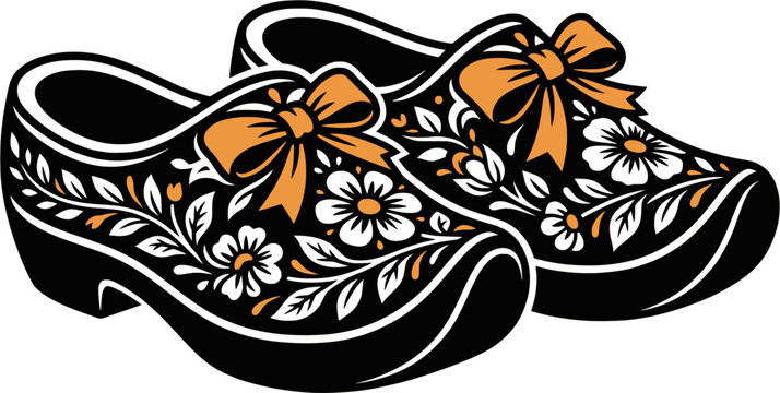 Dutch wooden clogs with orange ribbons and blooming flowers

