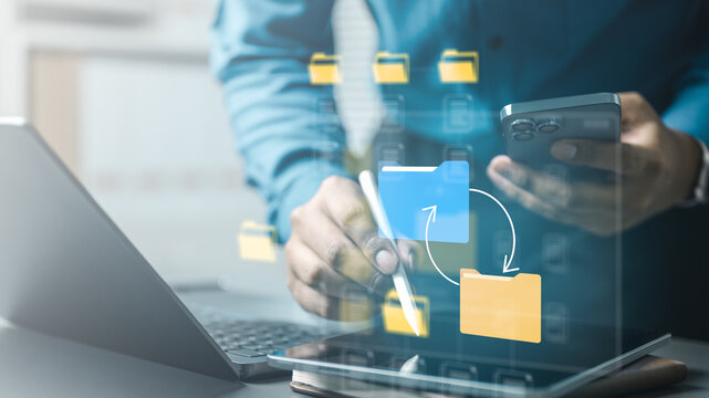 User managing file synchronization and resolving document conflicts across devices, illustrating cloud storage, version control and efficient digital workflow.