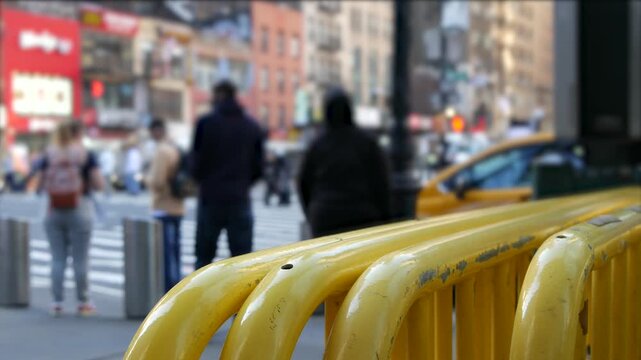 Manhattan Midtown street New York City, United States. Crossroad near Port authority bus terminal. Defocused car traffic on urban road, 8th avenue in Hells Kitchen. People pedestrian, yellow taxi cab.