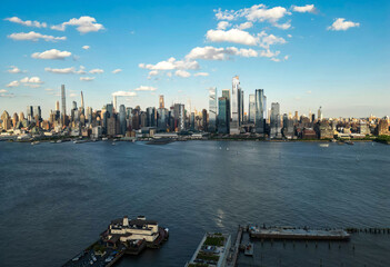 New York City an sky with clouds. NYC cityscape with skyscrapers. Aerial panorama of New York City...