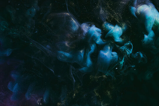 Abstract colorful blue smoke on black background. Moving flow of paints, fluid liquid art, space sky