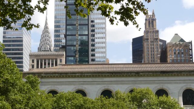 New York City Manhattan Midtown United States of America. Bryant park library building on 42 street 5 fifth avenue. Skyscraper skyline urban cityscape. High-rise tower, summer greenery. Public library