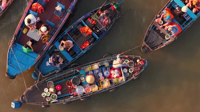 Aerial view of Cai Rang floating market, Can Tho, Vietnam. It is famous market in Mekong Delta, Vietnam. Tourists have breakfast on a boats, buy and sell food, vegetable, fruits on boat, ship