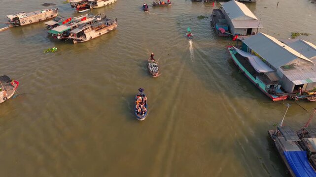 Aerial view of Cai Rang floating market, Can Tho, Vietnam. It is famous market in Mekong Delta, Vietnam. Tourists have breakfast on a boats, buy and sell food, vegetable, fruits on boat, ship