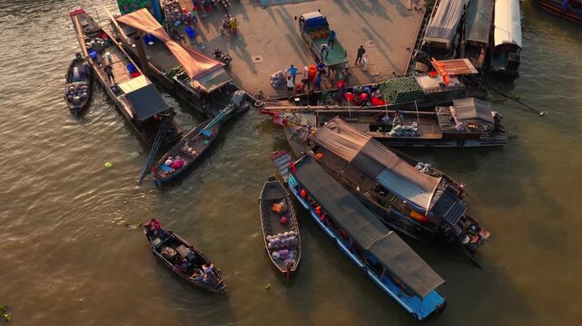 Aerial view of Cai Rang floating market, Can Tho, Vietnam. It is famous market in Mekong Delta, Vietnam. Tourists have breakfast on a boats, buy and sell food, vegetable, fruits on boat, ship