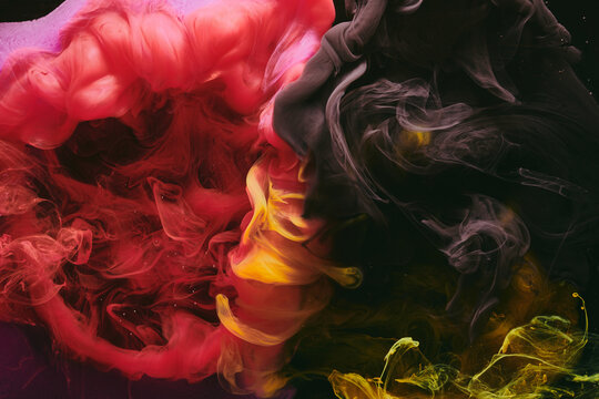 Abstract colorful red black background. Moving flow of paints, fluid liquid art, space sky