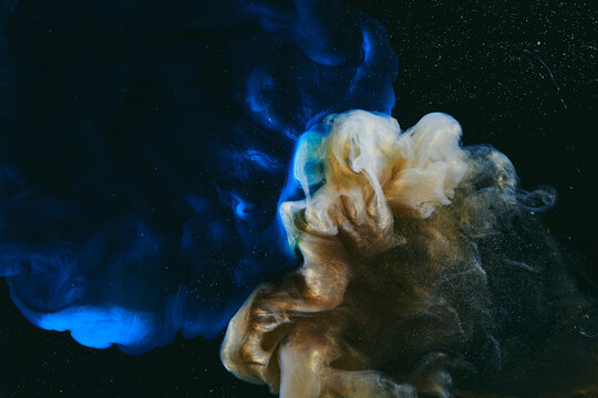 Abstract colorful blue smoke on black background. Moving flow of paints, fluid liquid art, space sky