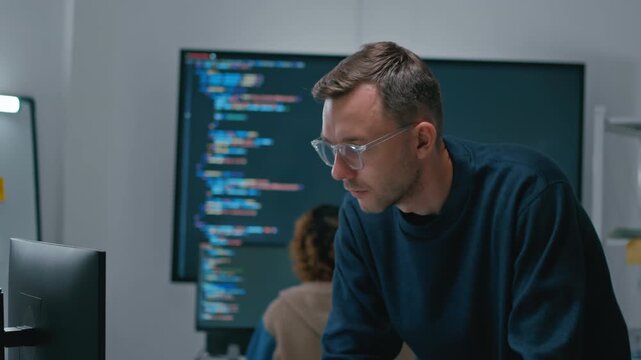 software engineers team developing autonomous AI agents and agentic terminal coding in a cowork environment.Concept of constitutional AI,agentic coding,large language models and reinventing software.
