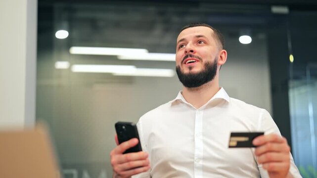 Individual engaged in mobile commerce, expressing happiness and satisfaction with a secure digital transaction. Displays a pleased demeanor while utilizing modern payment methods.