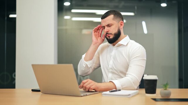 Business professional experiencing severe headache or ear pain during work. Feelings of discomfort and frustration evident, impacting concentration and productivity. Office environment adds pressure.