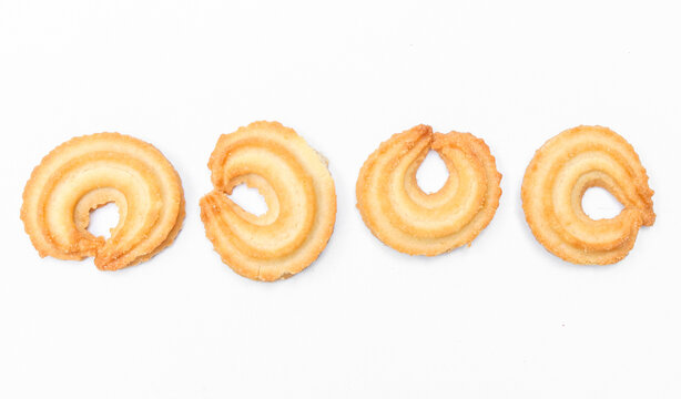 Round vanilla ring shaped butter cookies. Assorted butter cookies in various shapes isolated on white background.