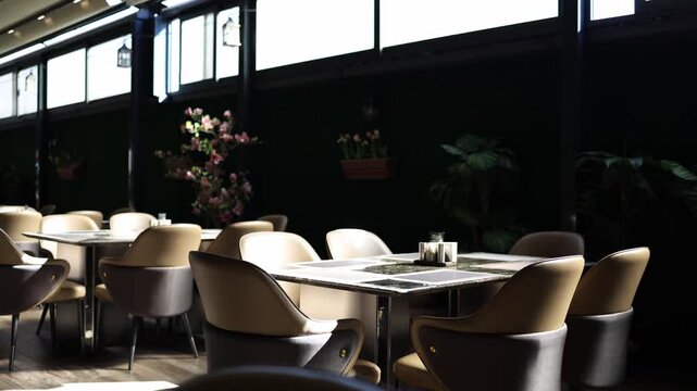 Stylish modern restaurant interior with empty tables soft chairs natural sunlight and cozy atmosphere creating elegant dining space and calm hospitality mood