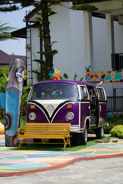 A Volkswagen Type 2 bus at Mikie Funland. The bus is decorated in bright purple for a photo opportunity. Indonesia - Berastagi, March 24, 2026, North Sumatra.