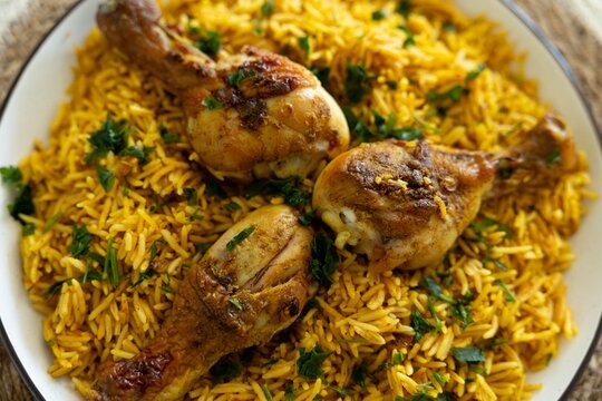 Middle eastern chicken kabsa or mandi with turmeric rice