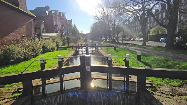 Locked-down video of the Grand Canal Lock, canal flowing closeup.