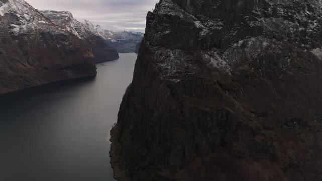Majestic cliffs of Aurlandsfjord in winter, UNESCO of Norway, outside of village of Undredal. 50fps