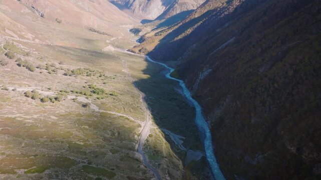 Drone reveal pullback shot of Kinnaur valley and Baspa river