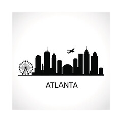 Fototapeta premium Silhouette of the atlanta skyline with a ferris wheel and airplane