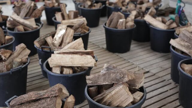 Prepared firewood in buckets for sale in garden or home improvement store