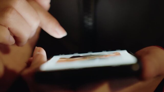Asian hands tapping illuminated phone screen, closeup of fingers with rings in low light, app icons and feeds visible, gentle swipe and tap gestures, shopping and messaging scenarios, intimate