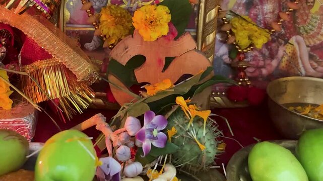 hindu home temple decorated for shivratri with holy om sign and offerings