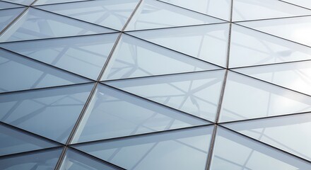 Fototapeta premium Modern architecture's glass facade featuring geometric design and light