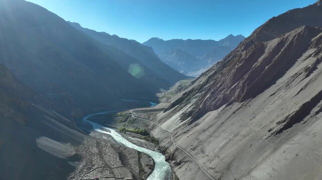 Aerial wide landscape of Baspa River and barren mountains in Chitkul, Himachal Pradesh.