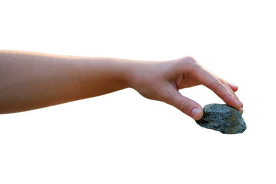 Woman hand holding small grey stone. Natural mineral pebble picked up by fingers. Concept of nature, geology exploration, finding value and zen balance on isolated transparent background.