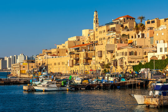 Old buildings of Yafo overlooking small port on Mediterranean sea.